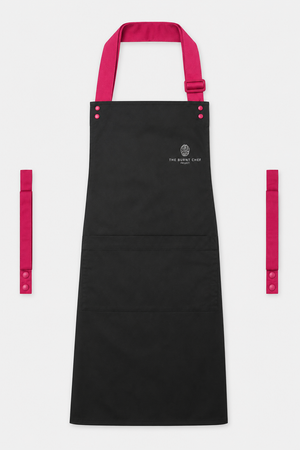 Black Swap & Pop apron with Hot Pink straps, left chest logo